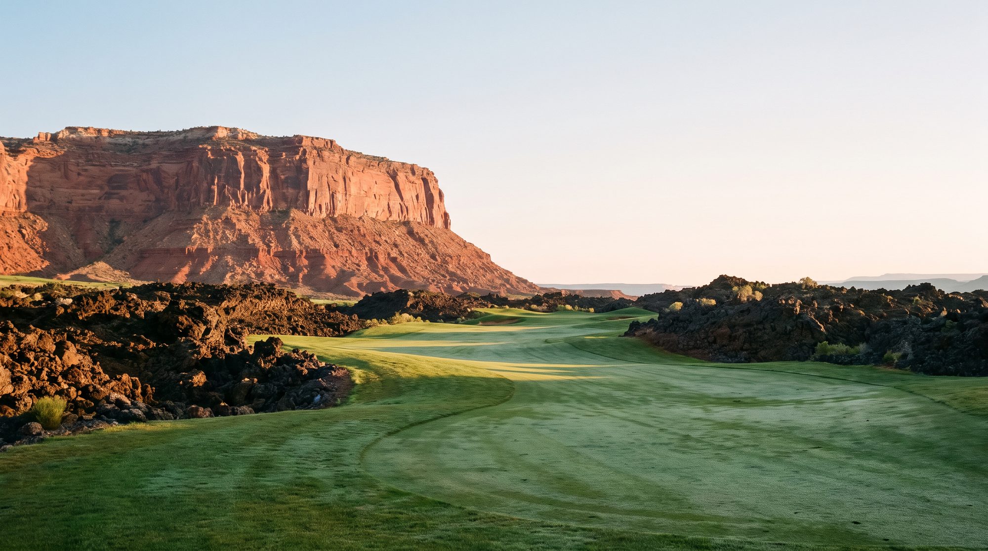 Southern Utah golf course below a red rock mesa